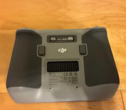 DJI RC controller. It has a screen protector on so there are no scratches on the screen. I used this for my Mini 3 before it crashed and of course my new one doesn’t work with this. No holds Image #2